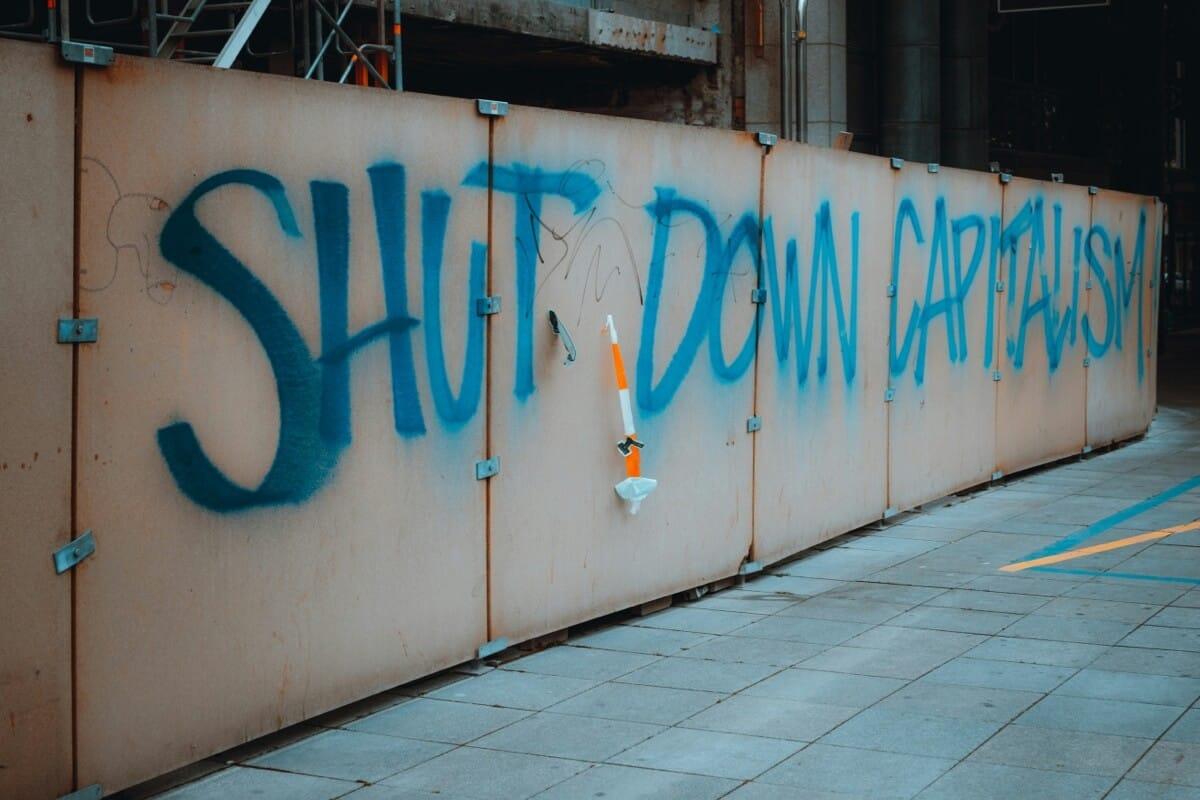 Graffiti reading "Shut down capitalism"