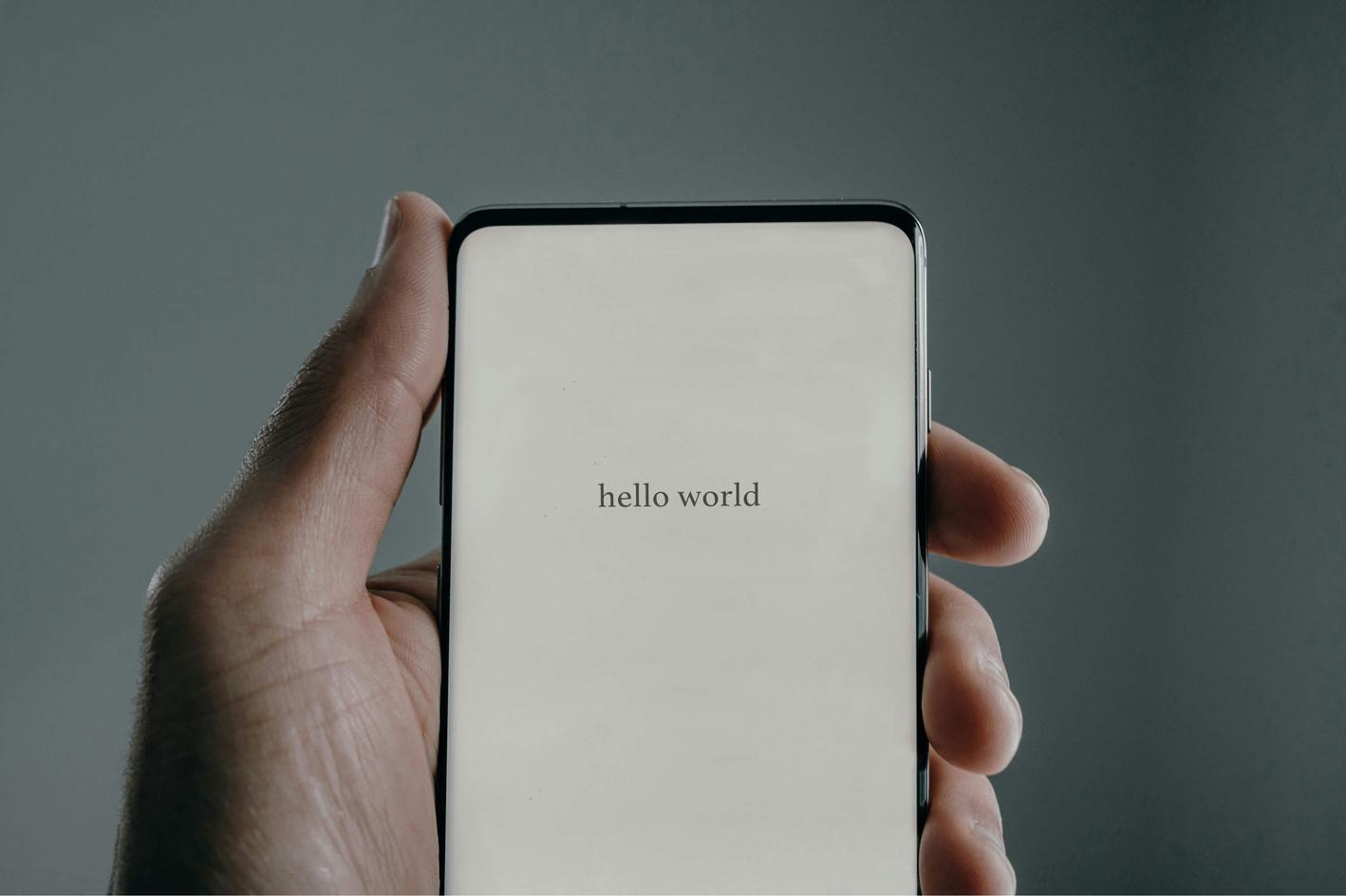 Phone screen showing "Hello world" text